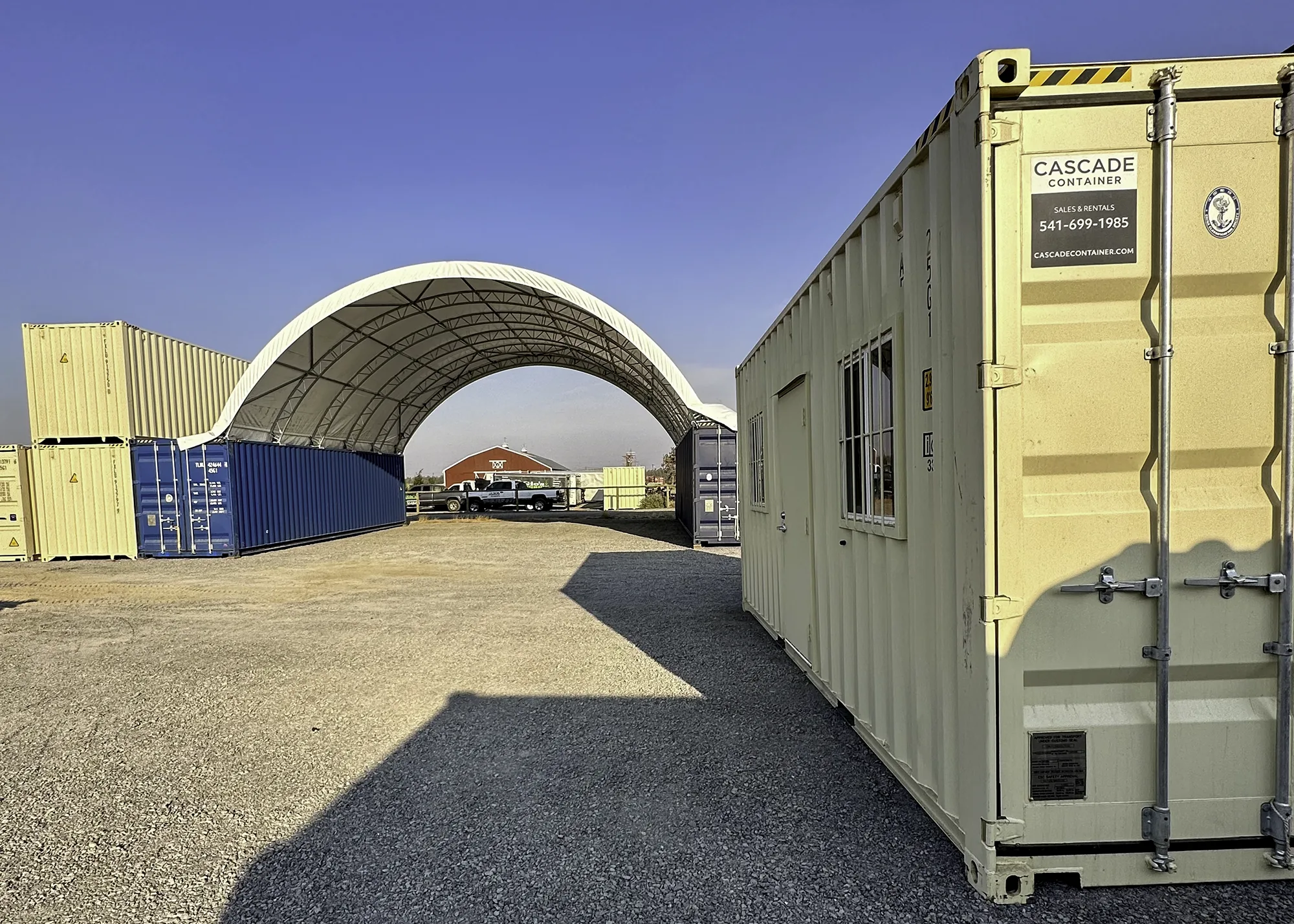 Container canopy installed between two shipping containers